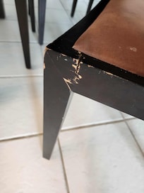 Broken chair poorly glued back together