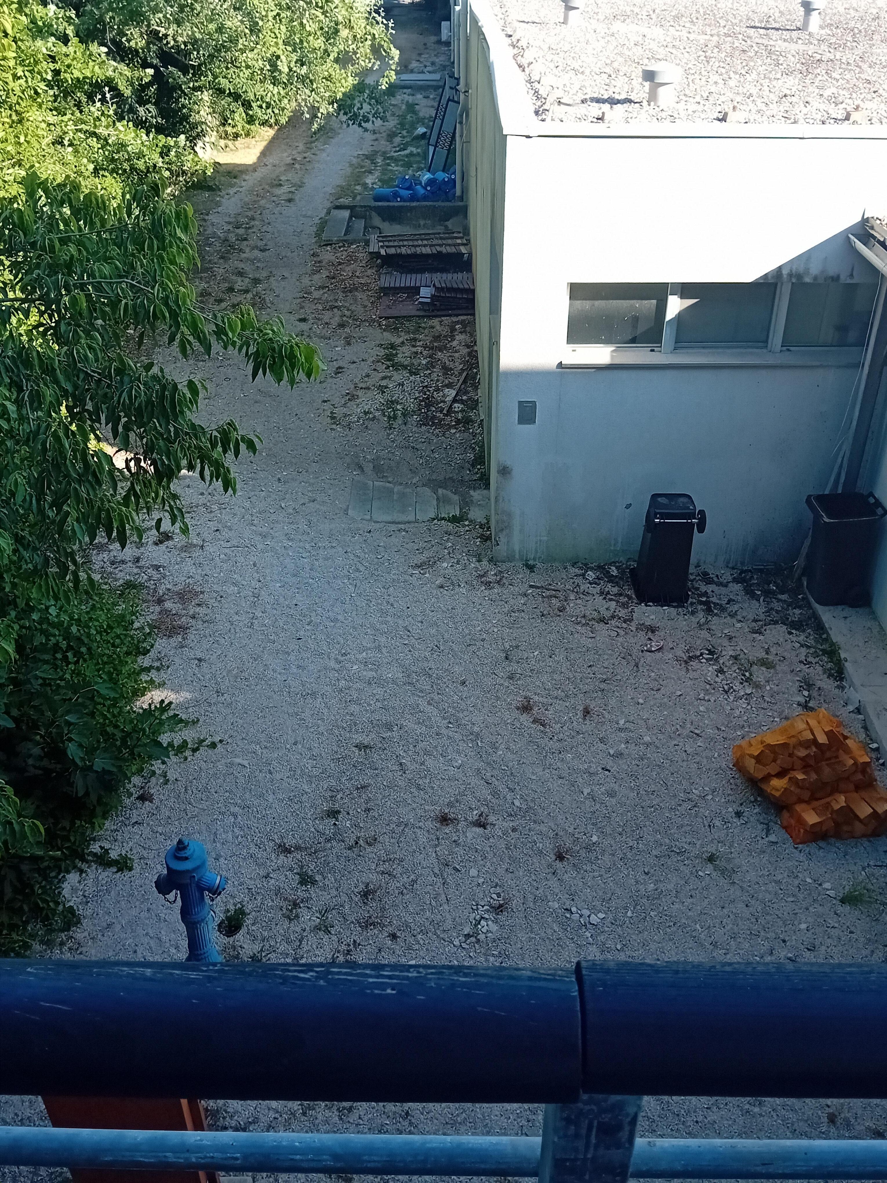 View from room 104. This was the hotel grounds. Not as described/ not a luxury hotel. Like looking into a scrap yard.