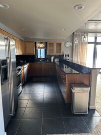 Open galley kitchen that looks out over the water.