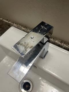 old worn out faucet. chrome finish rusted off