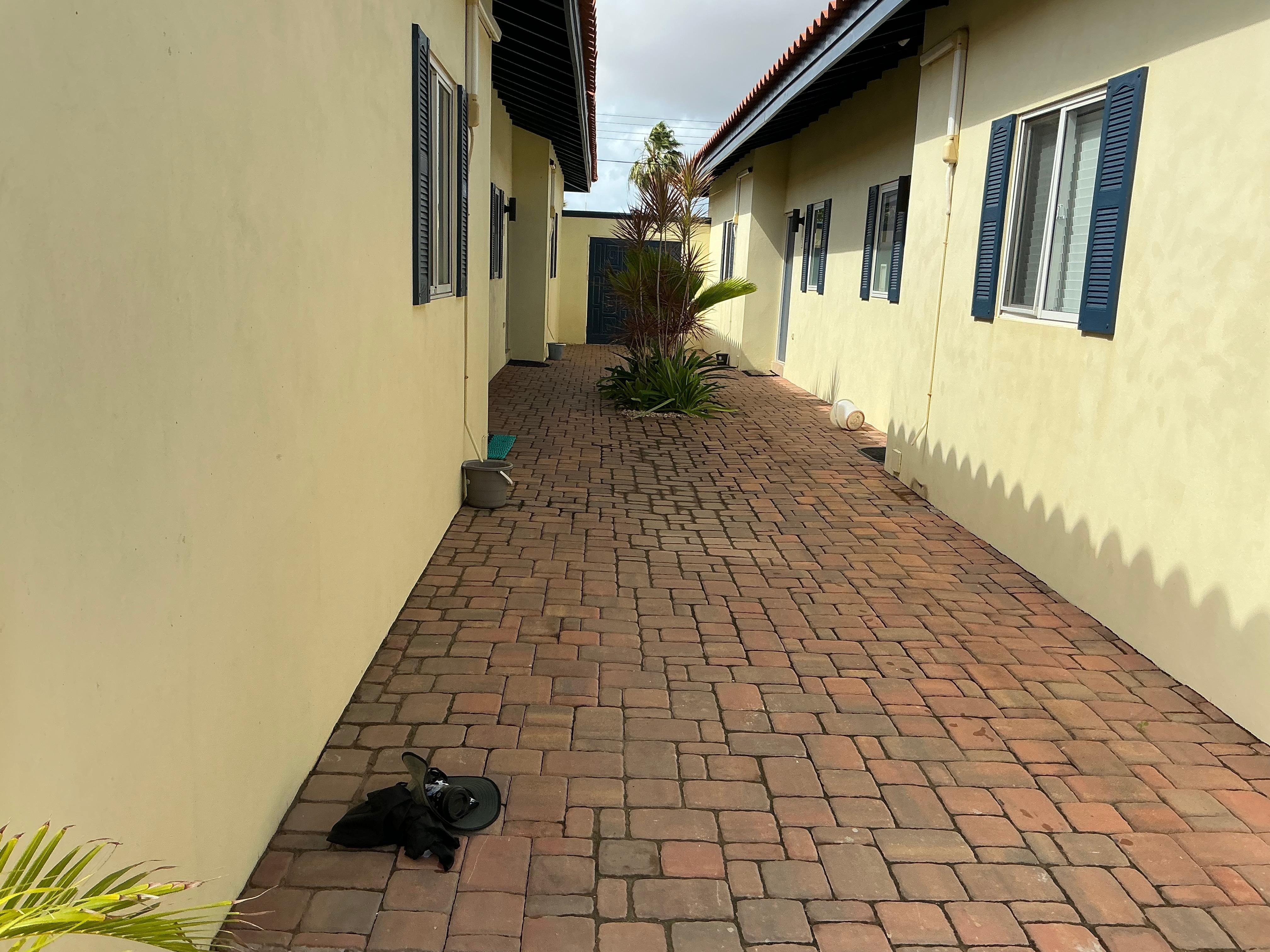 Courtyard from pool area to front gate