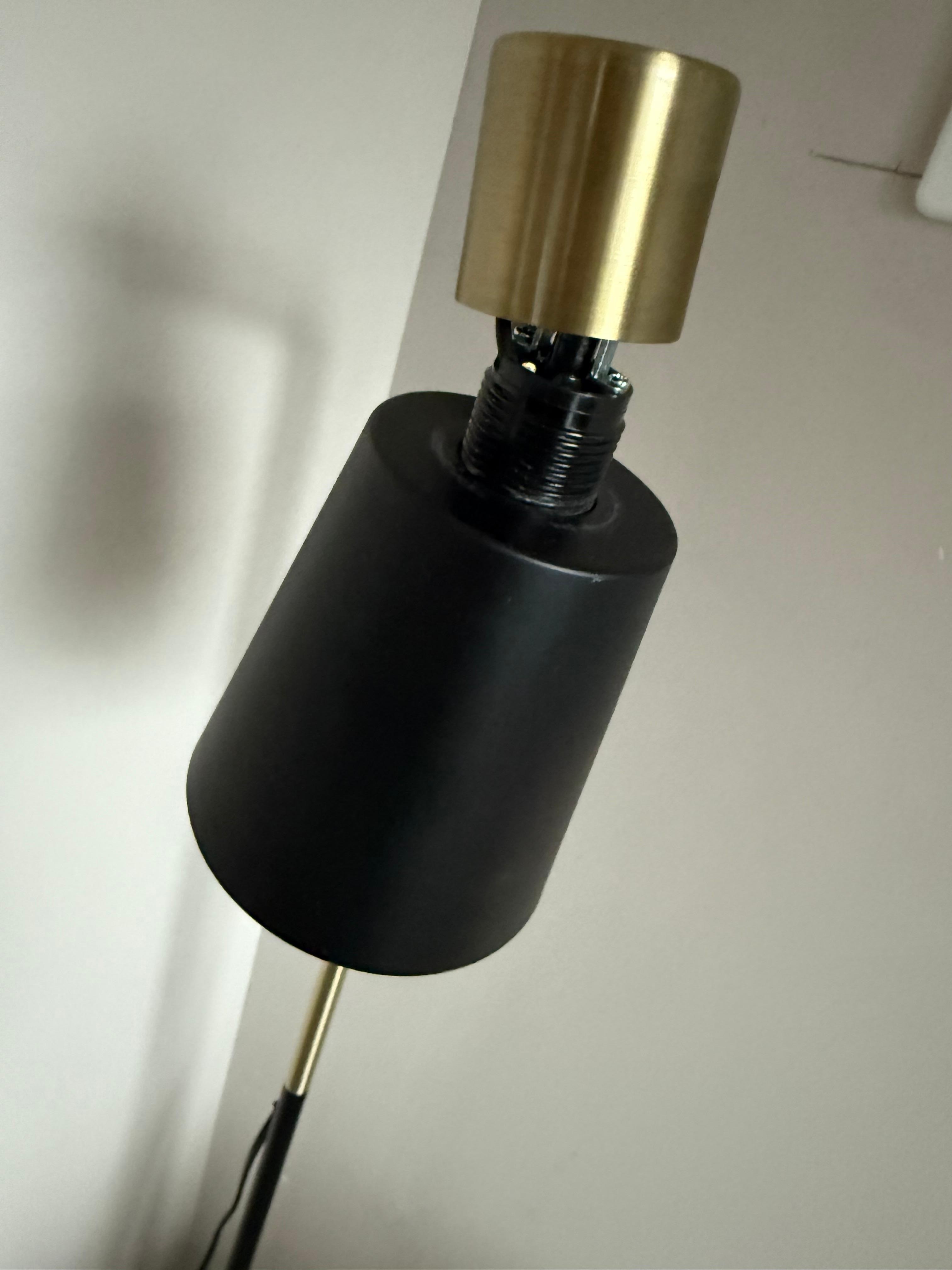 Lamp broken and hanging by a wire 