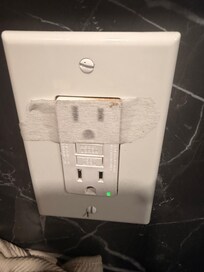 Half the plugs throughout the house were taped over.