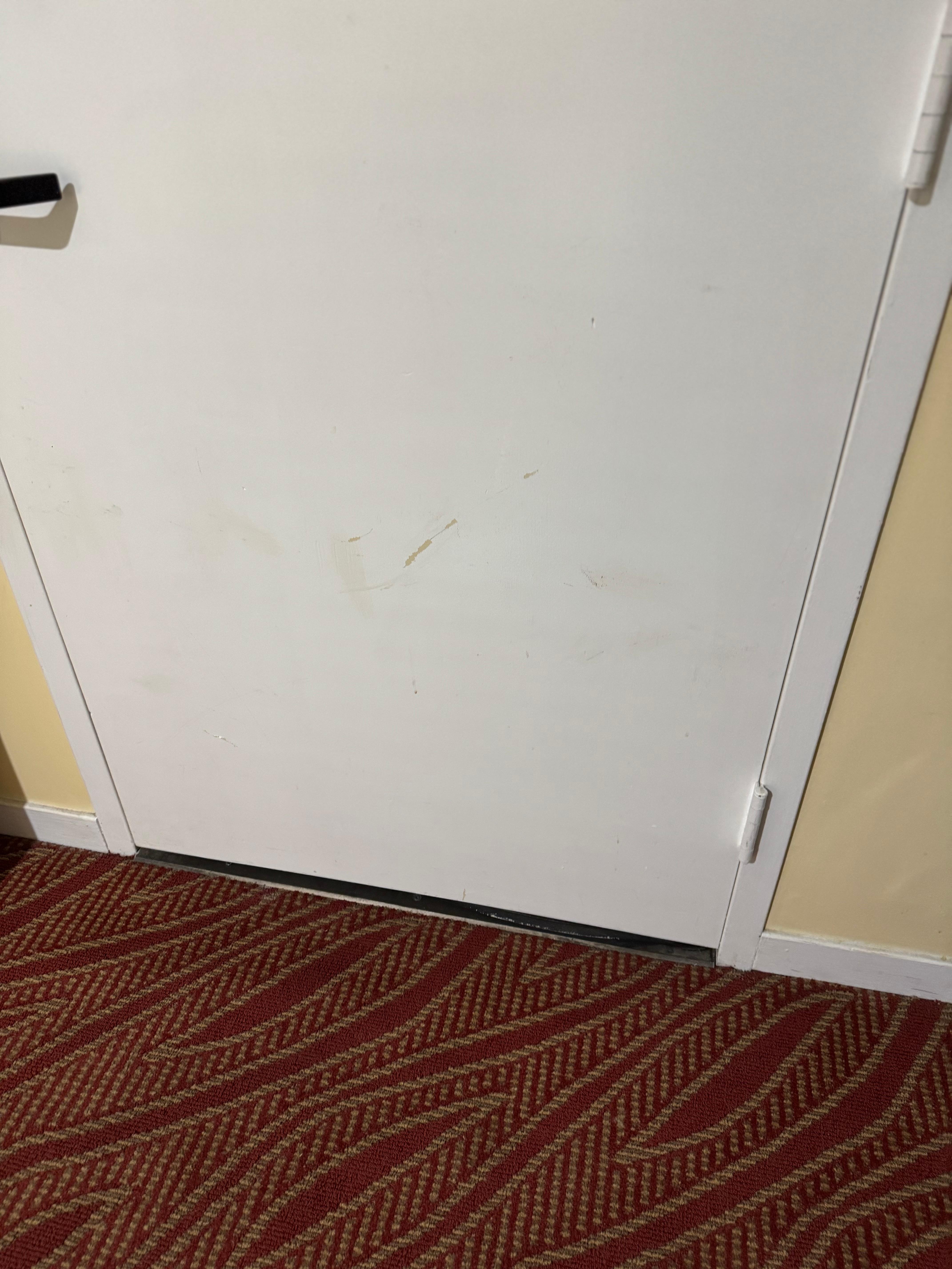 Filthy door. Grime and dirt marks. Never been wiped down. Again proof management never inspects rooms