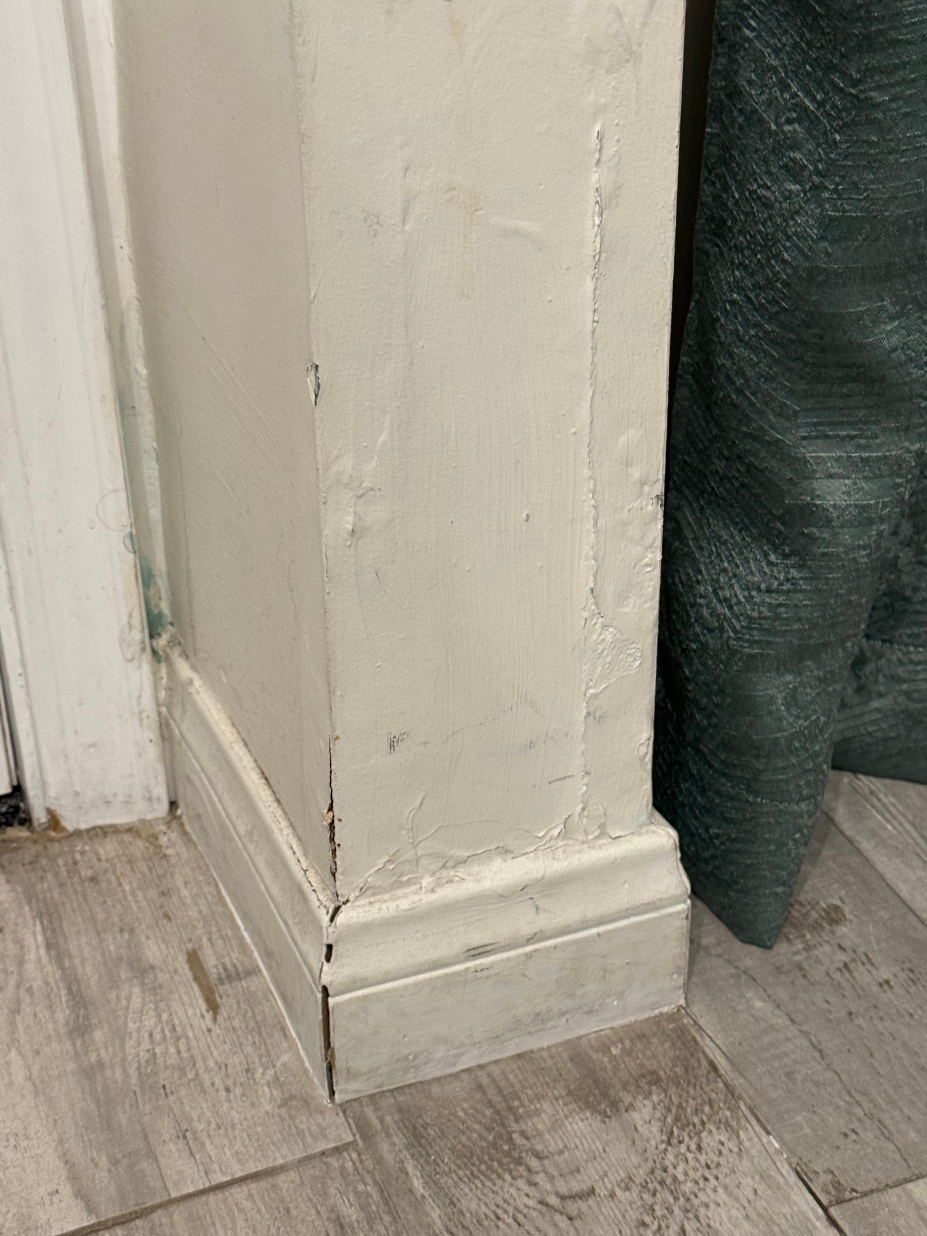 Significant wall/sheetrock damage in the living area.