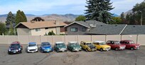 group photo of car club members lined up on north fencing
