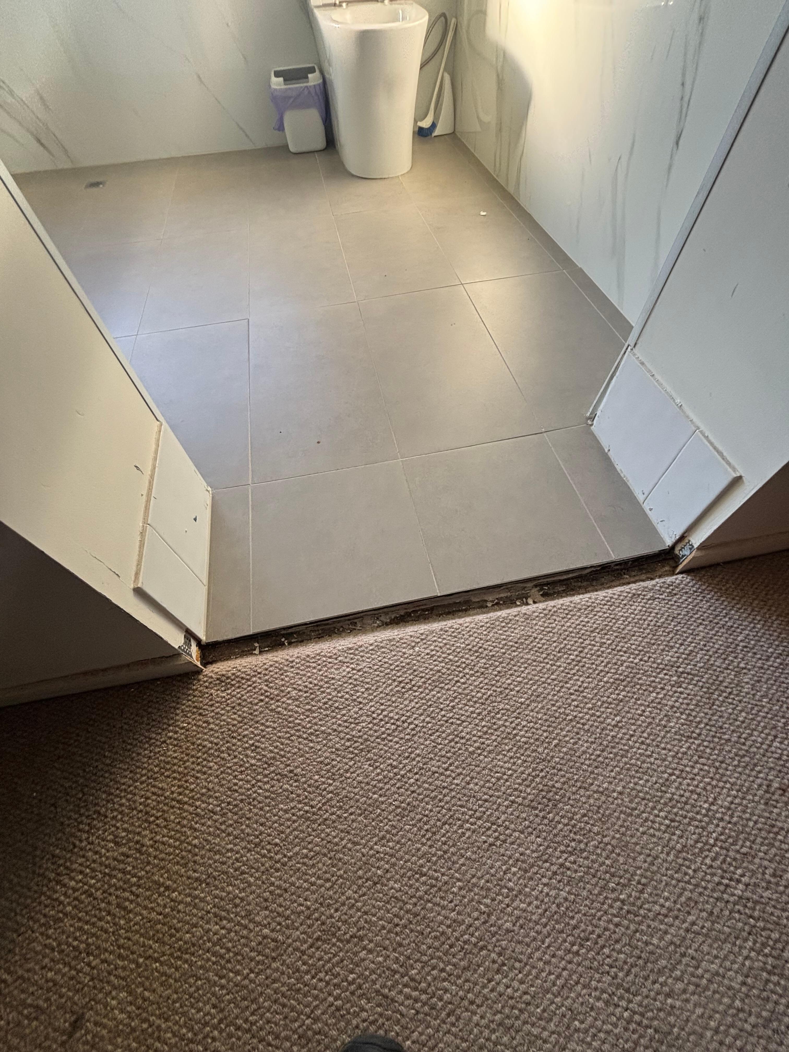 Trip hazard, tiles missing, gap in floor.