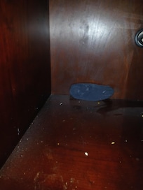 Sock and dirt behind microwave