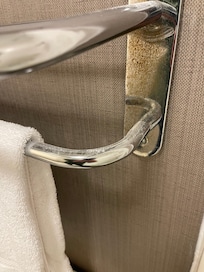 Drywall/plaster dust will on towel rack.