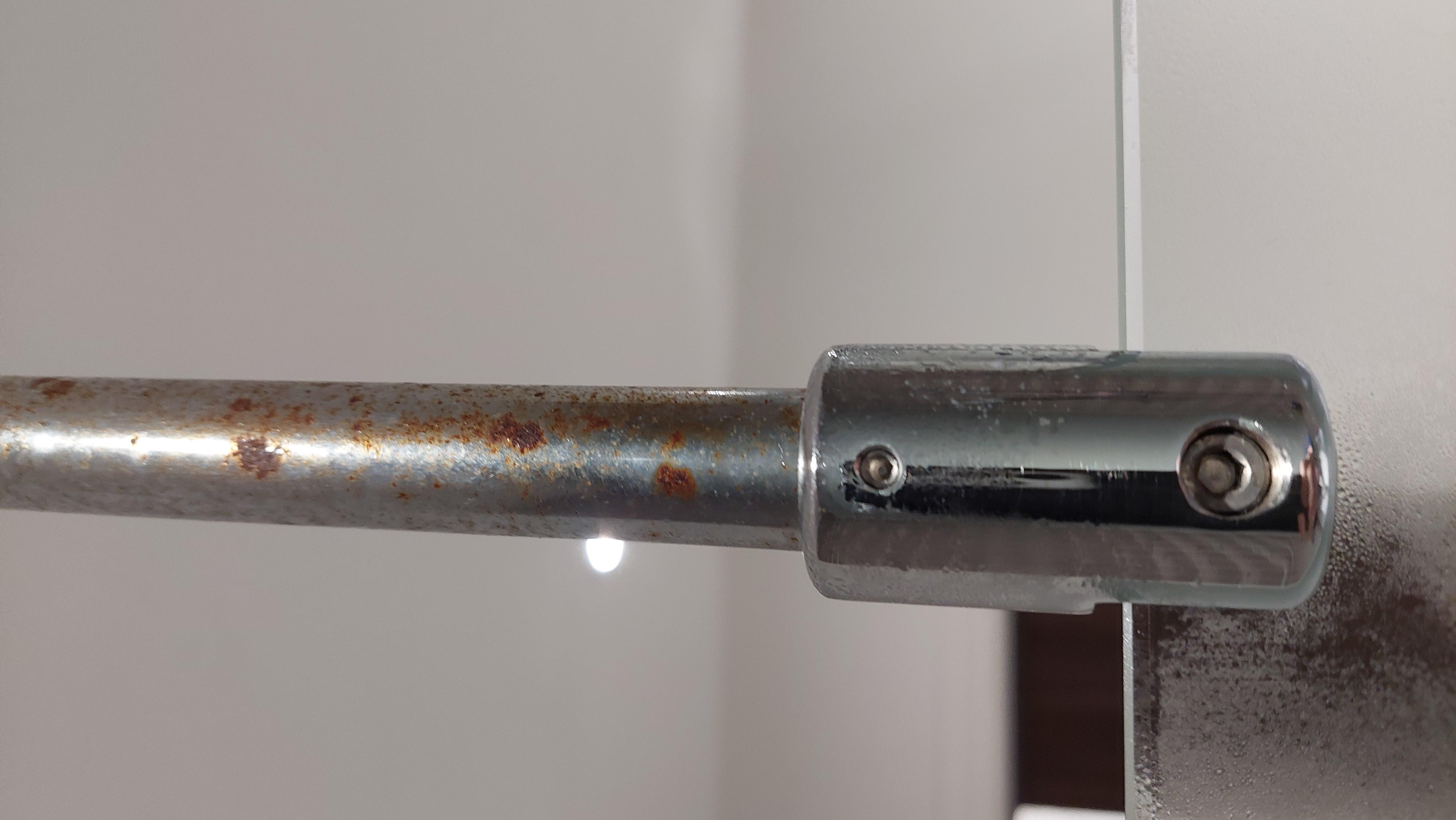 Rust on shower screen ceiling  support bar