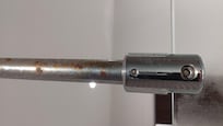 Rust on shower screen ceiling support bar