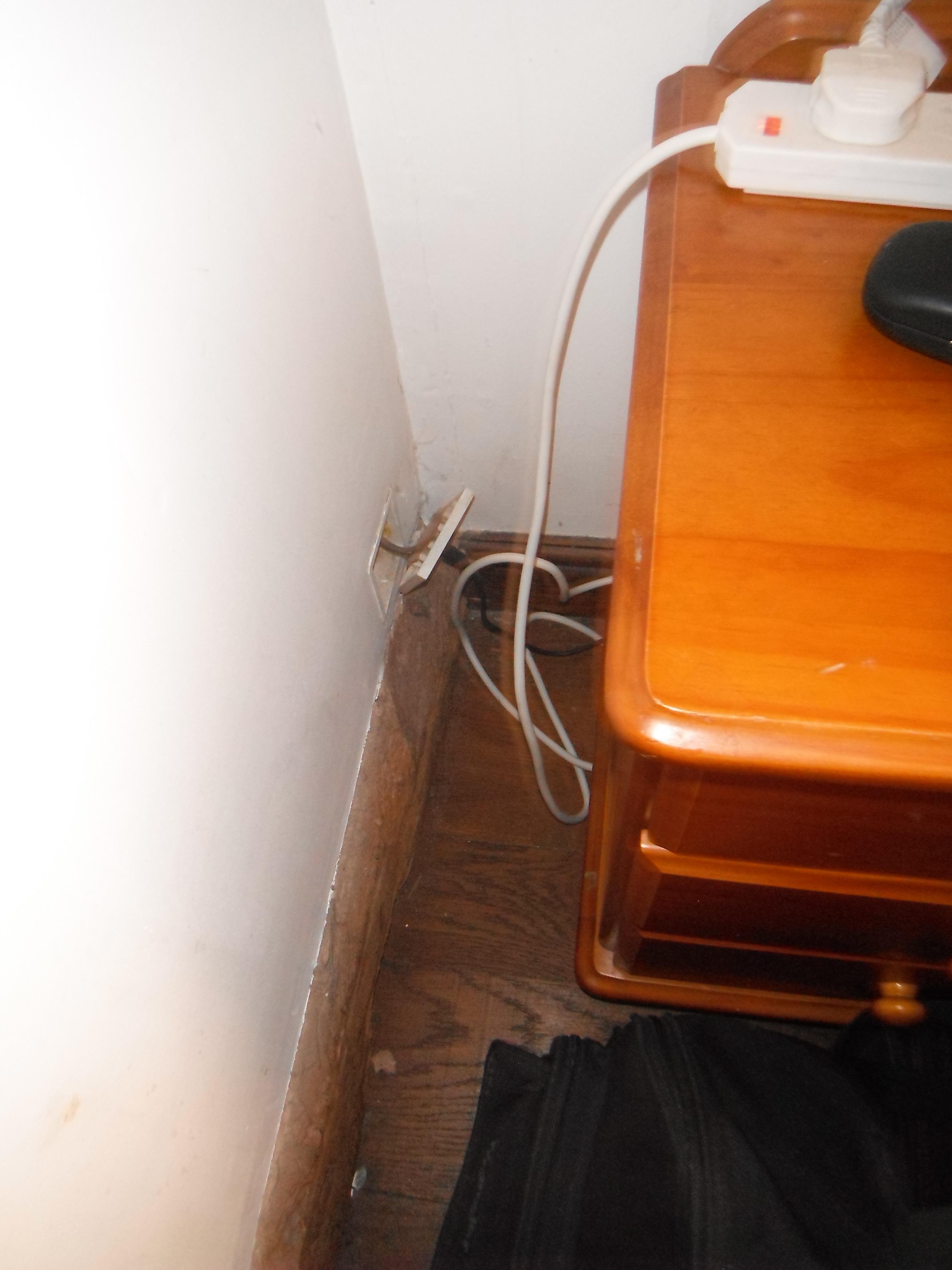 Socket not attached to the wall and an extention lead wired in