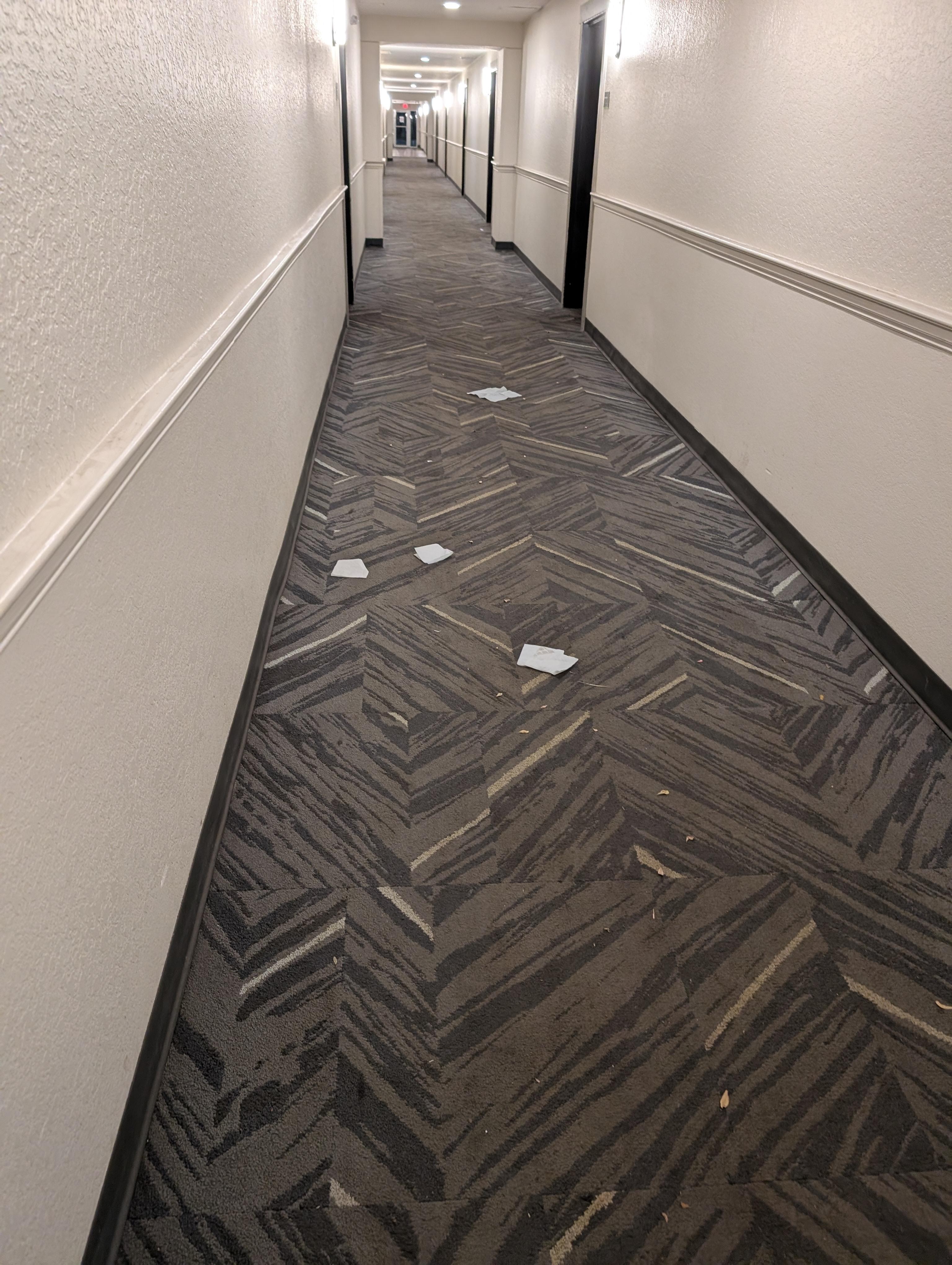 Hallway with trash.