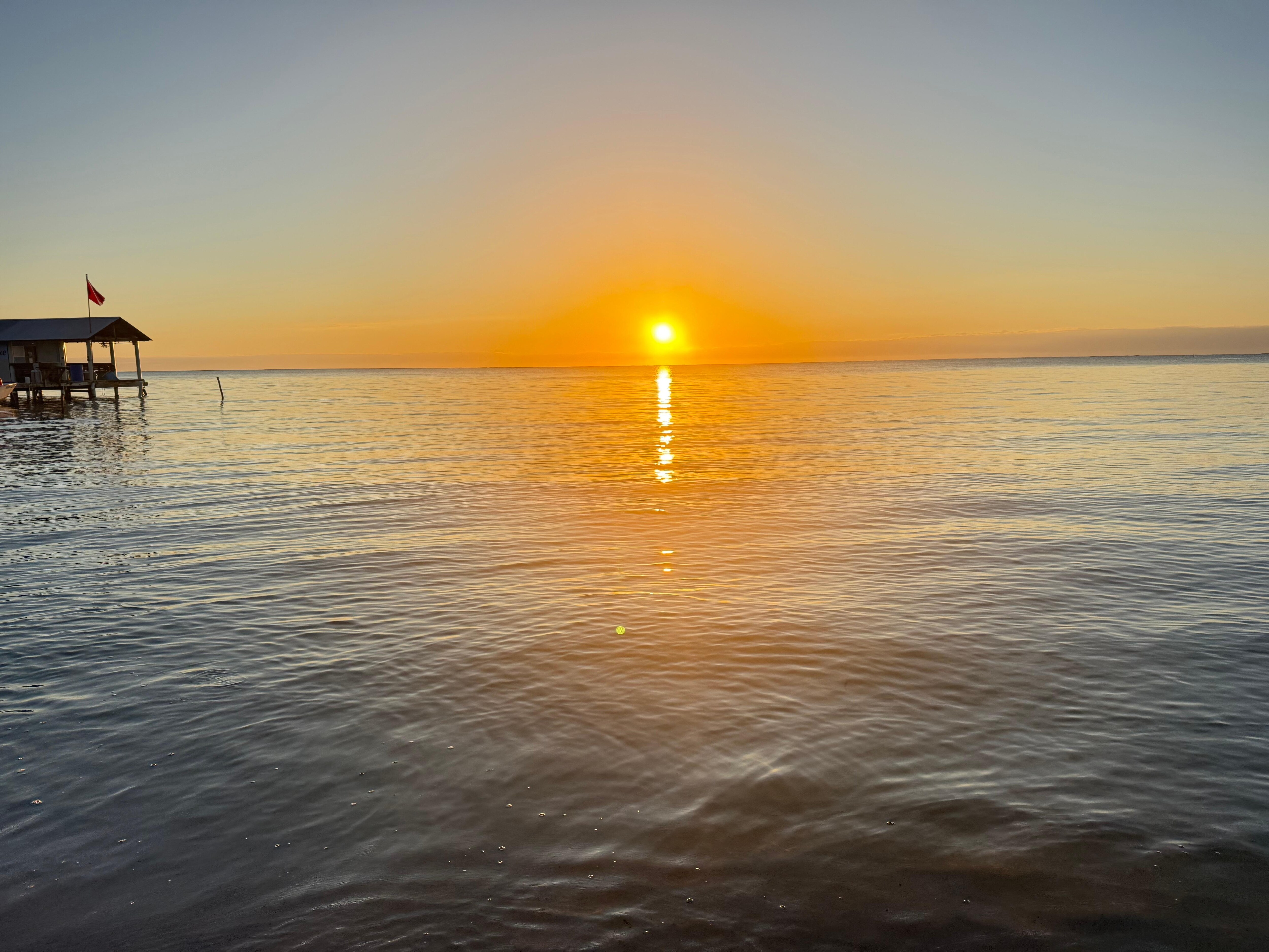 Morning sunrise from beach in front of property