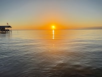 Morning sunrise from beach in front of property