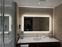 Spacious, clean bathroom with good lighting.