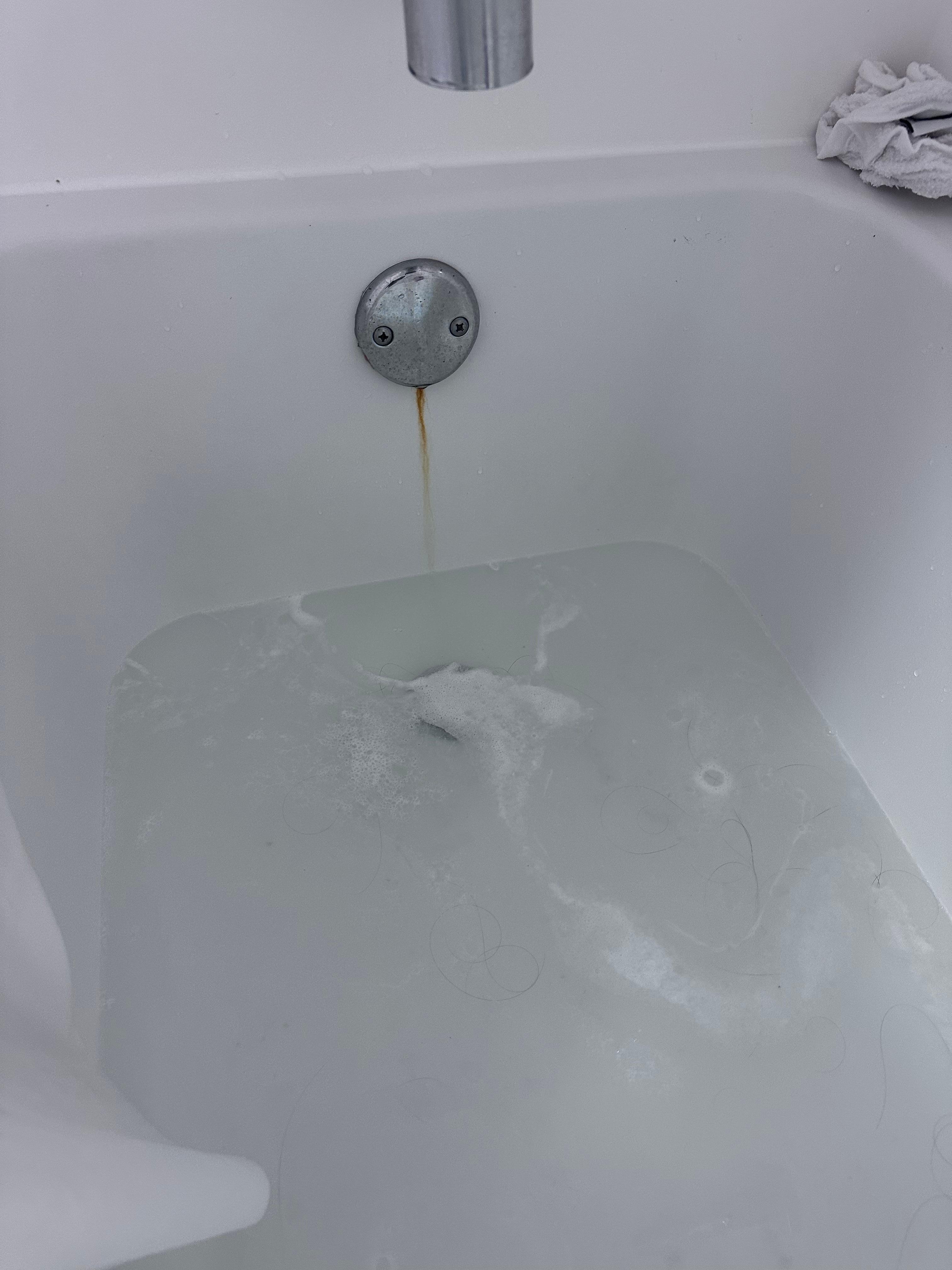 Standing water after showering. It would eventually drain.