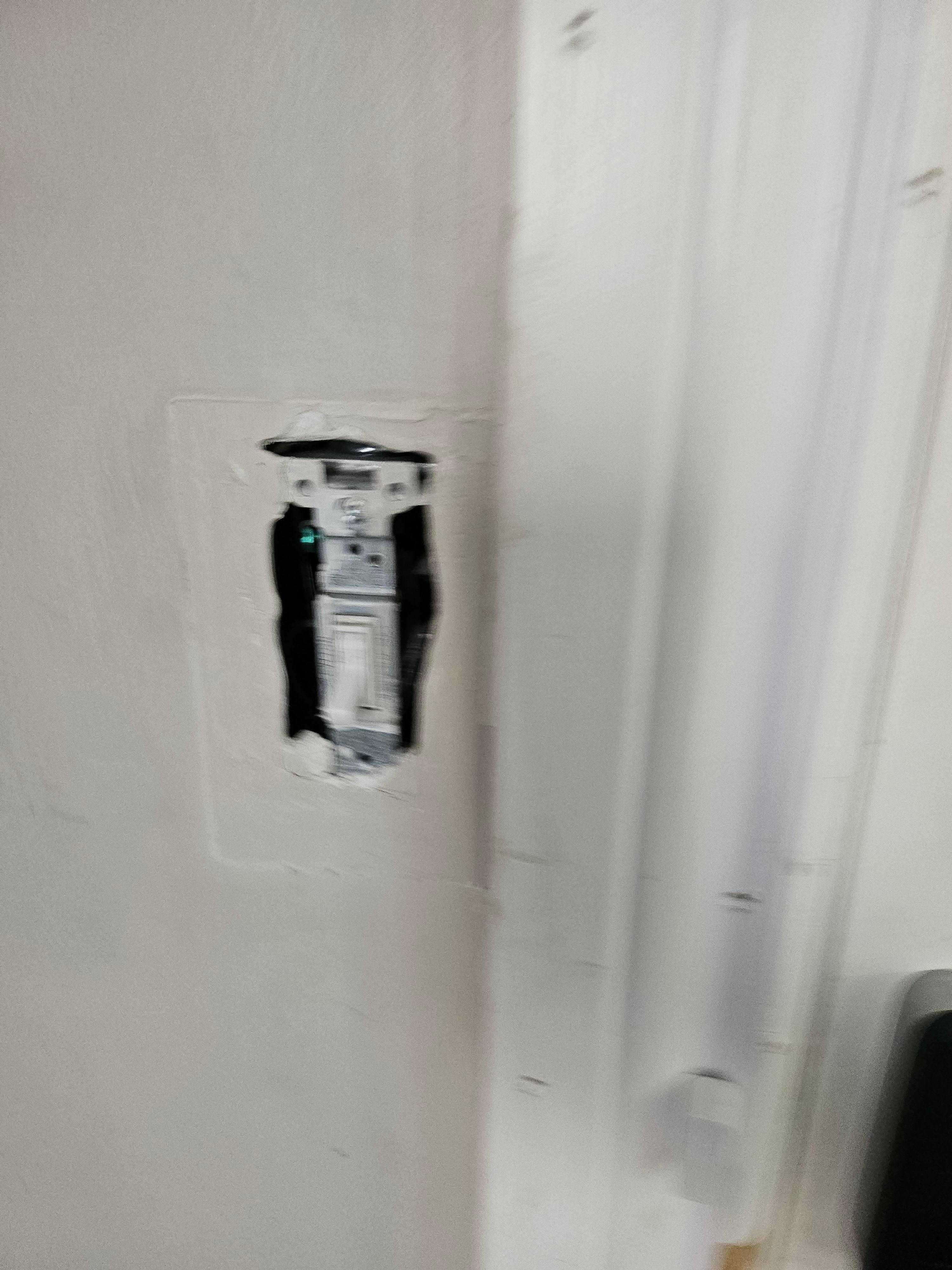 No cover light switch by door