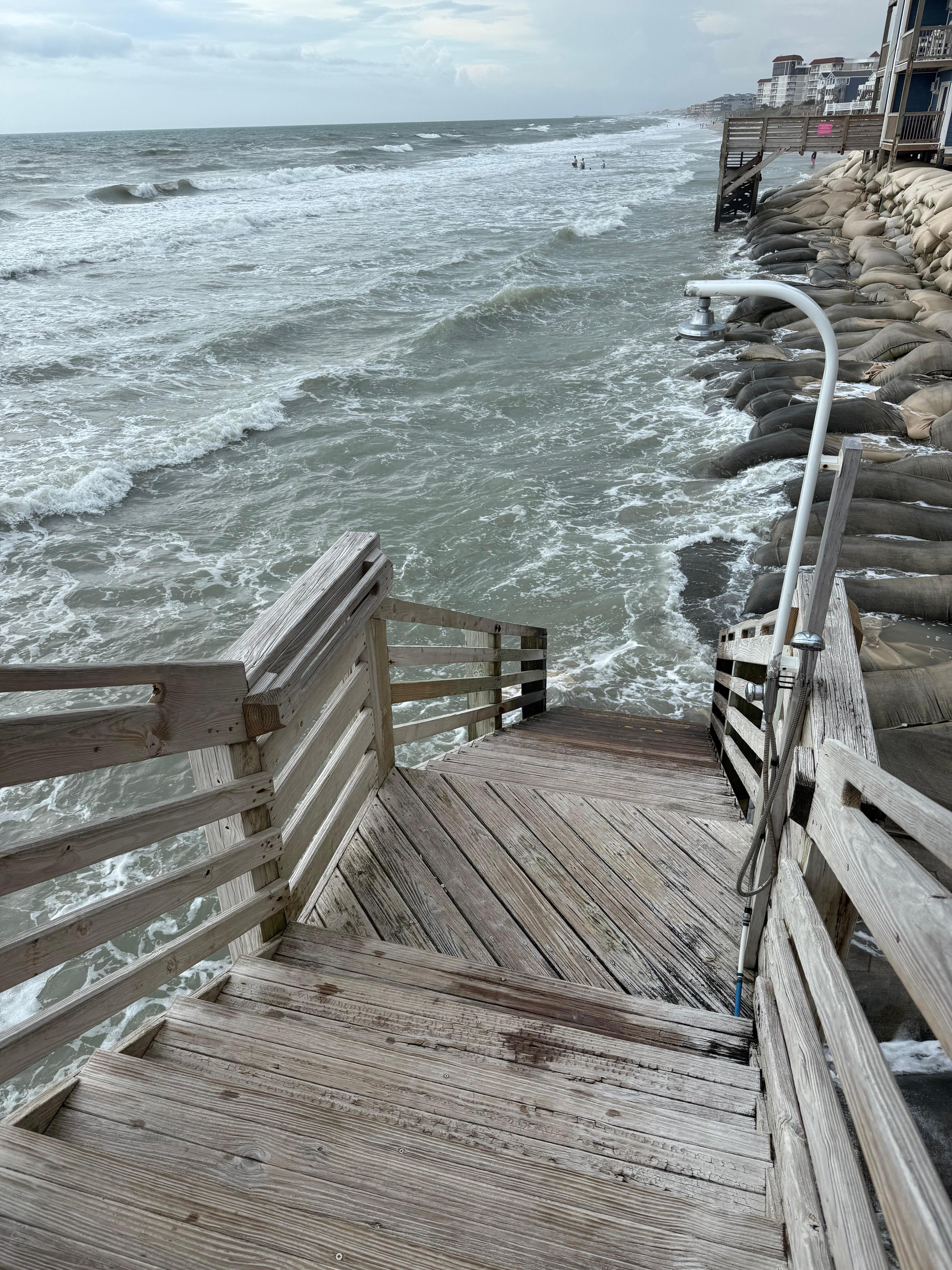 Beach access at high tide (midday). 
