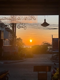 Sunrise from the hotel reception. That is the beach in the background, amazing.