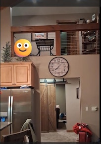 picture taken from balcony doors. left area is kitchen right is fireplace/living room
straight room is game room
Left back dining area