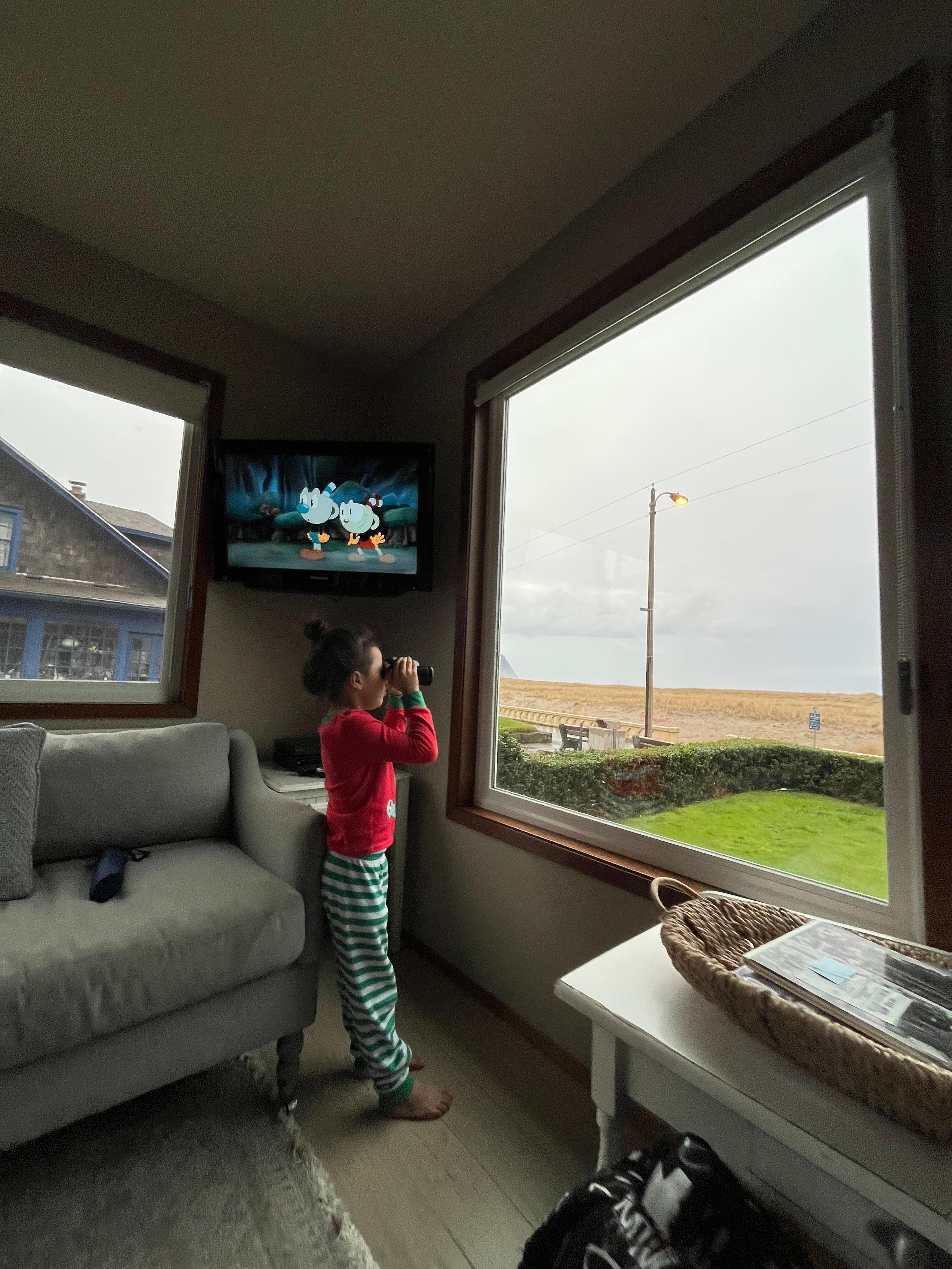 Looking out at the beach thru the binoculars that are provided by the house. The kids absolutely love them. 