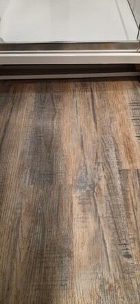 Vinyl 2 ft wide floor to slip on to from shower