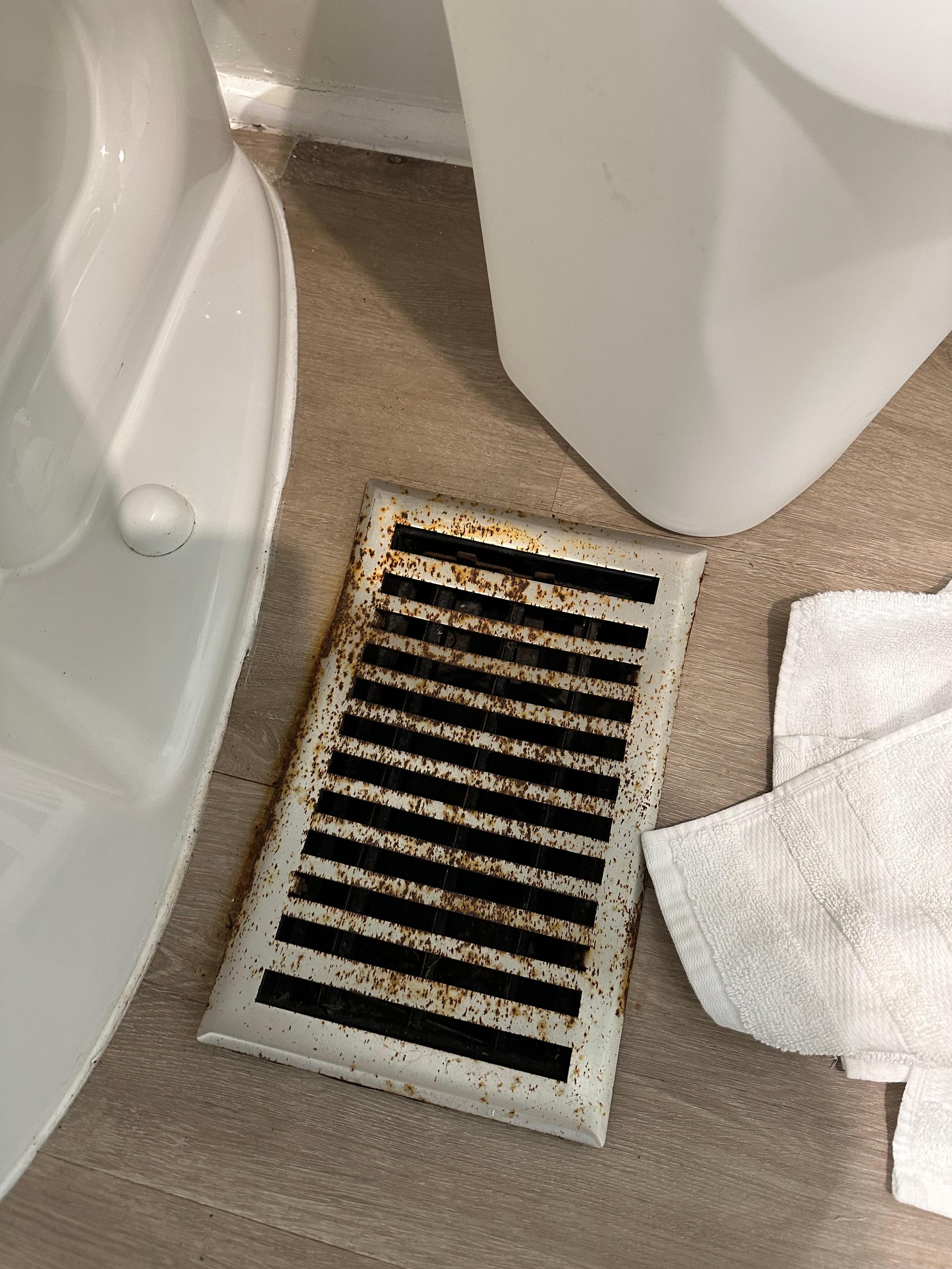 Rusted vents not even fastened down to floor.