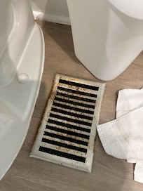 Rusted vents not even fastened down to floor.