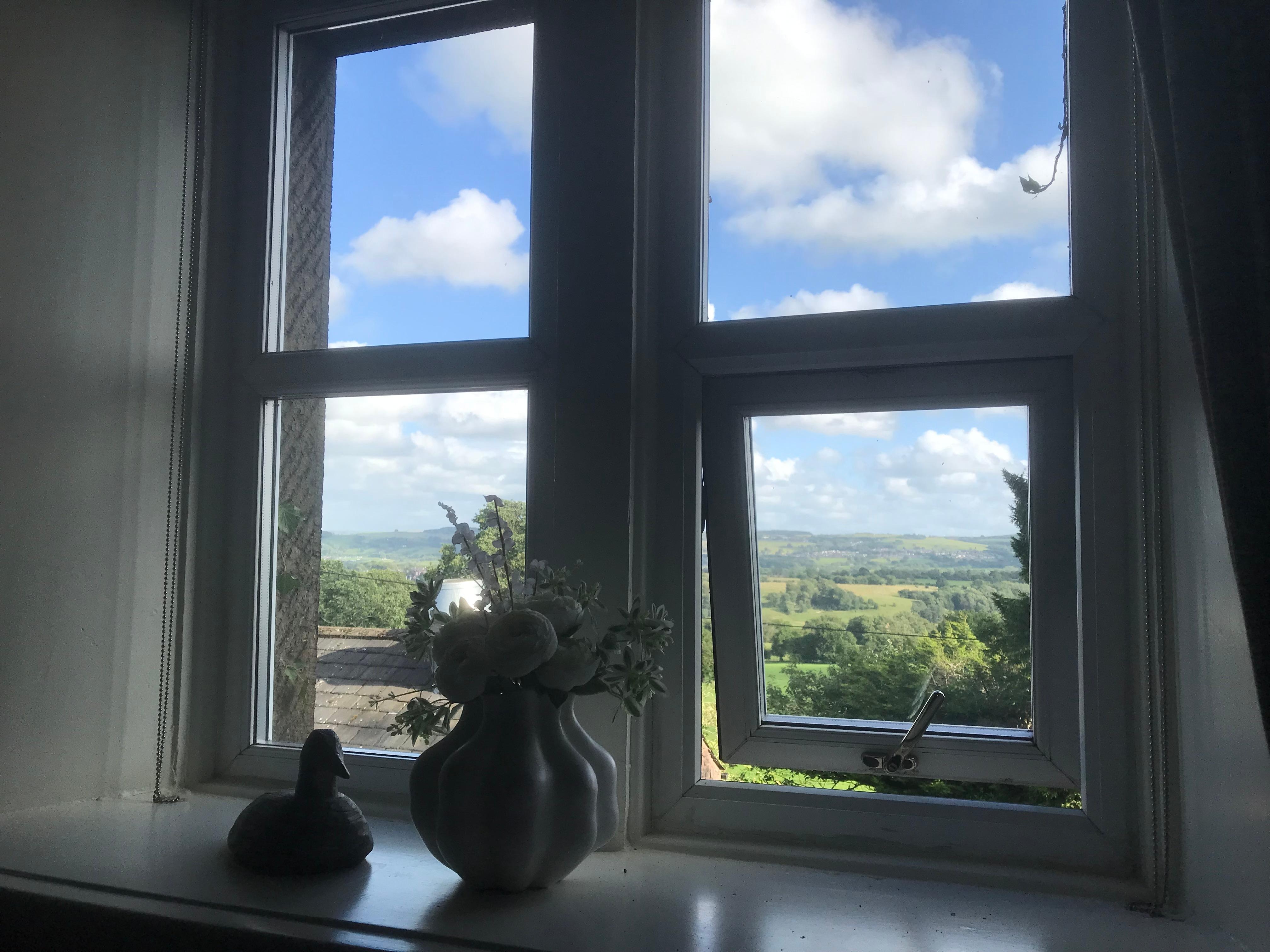 Two large windows in the four poster room with stunning views over the valley.