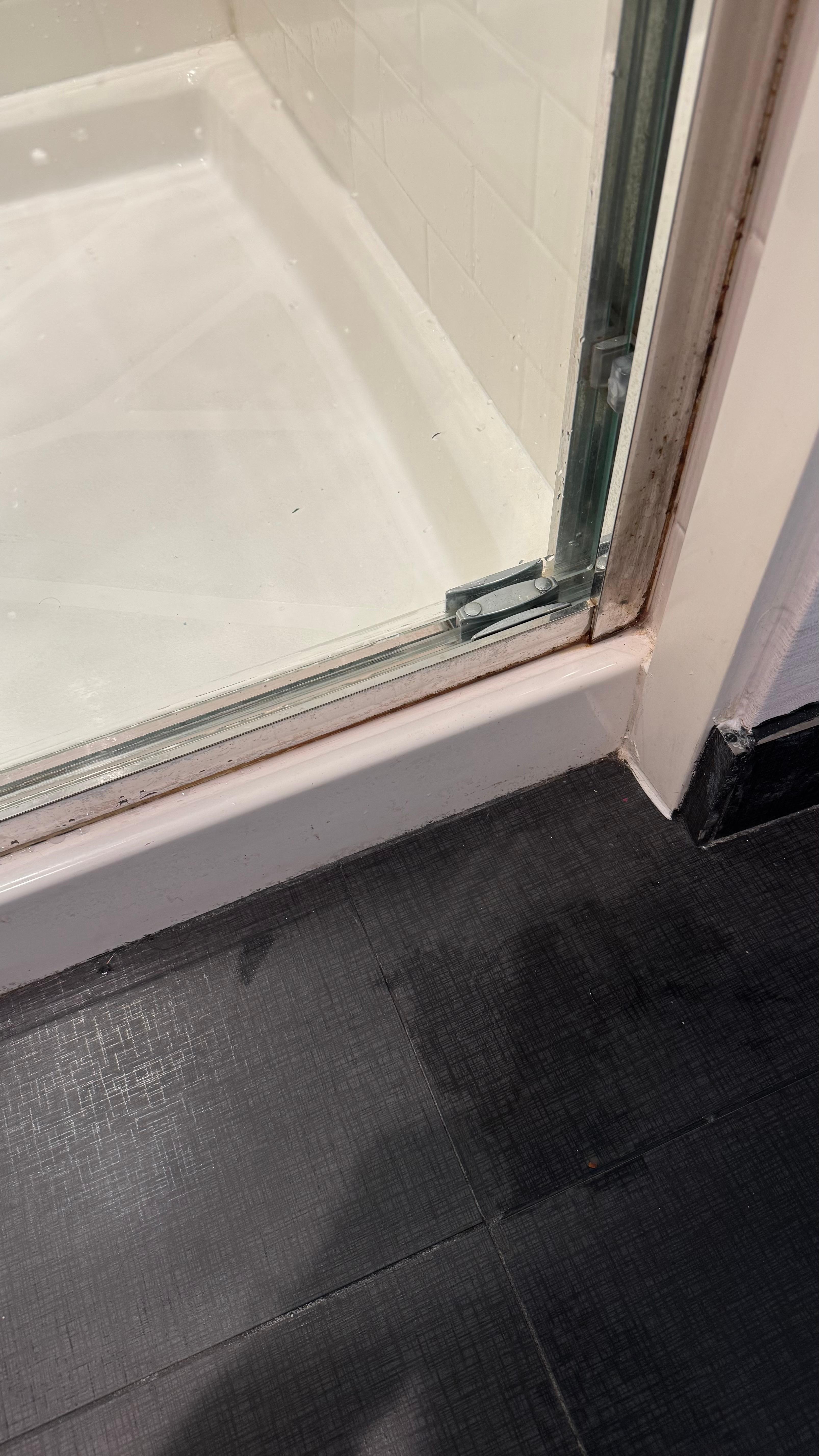 The shower has nasty grime on the bottom of the door!!