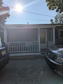 Front of house, two parking spots