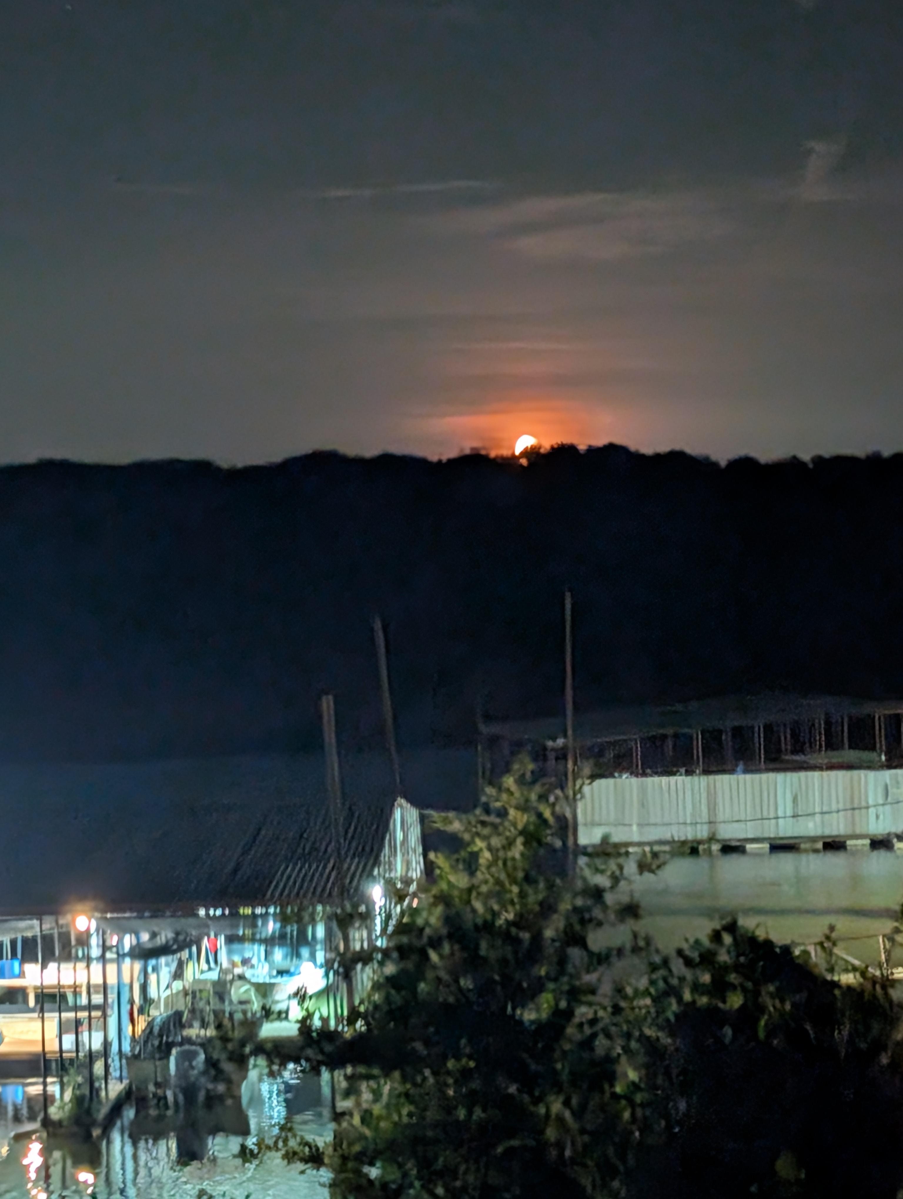 Moon rising from in front of the cabin