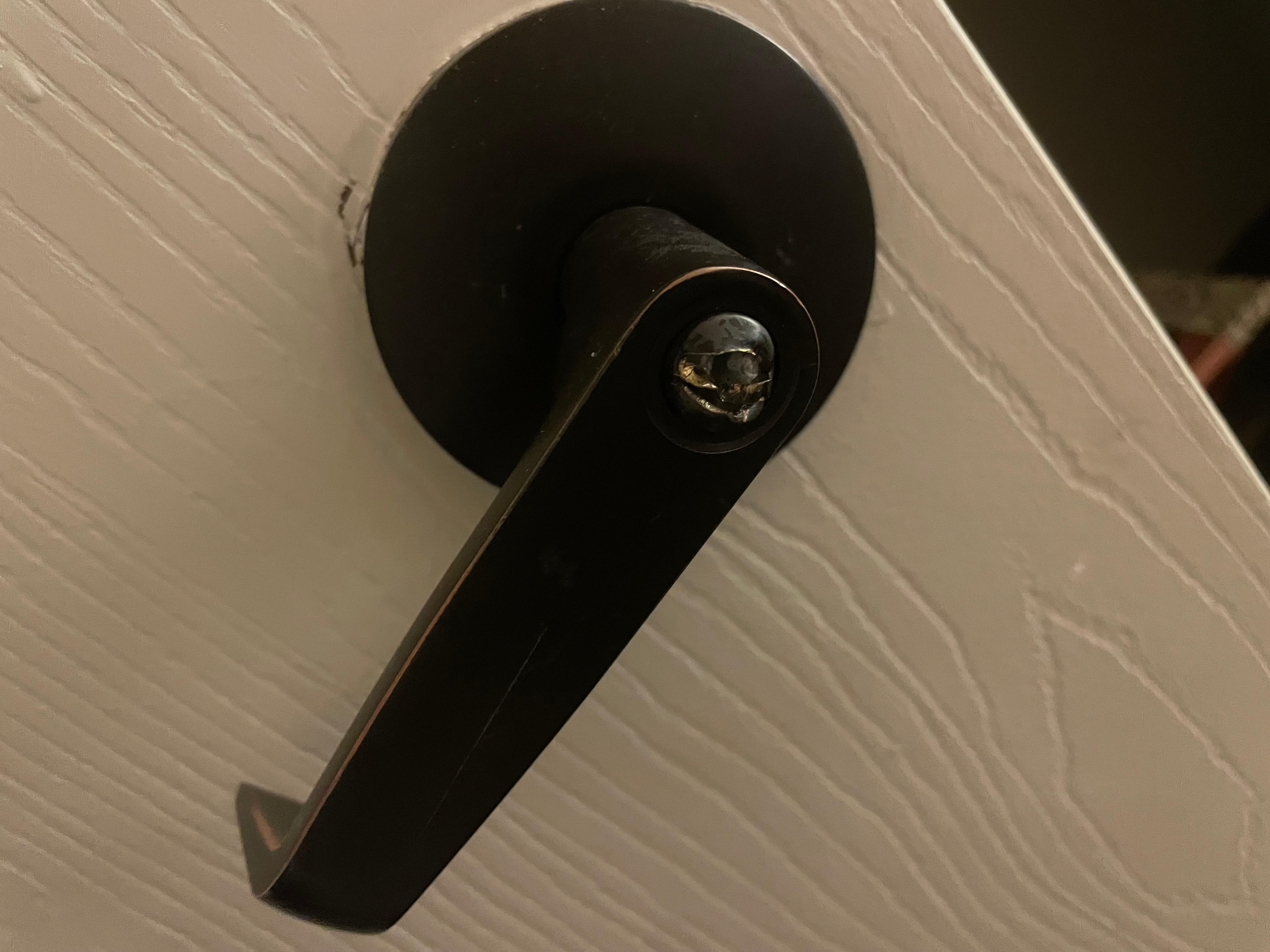 Broken room door handle locks with sharp metal. 