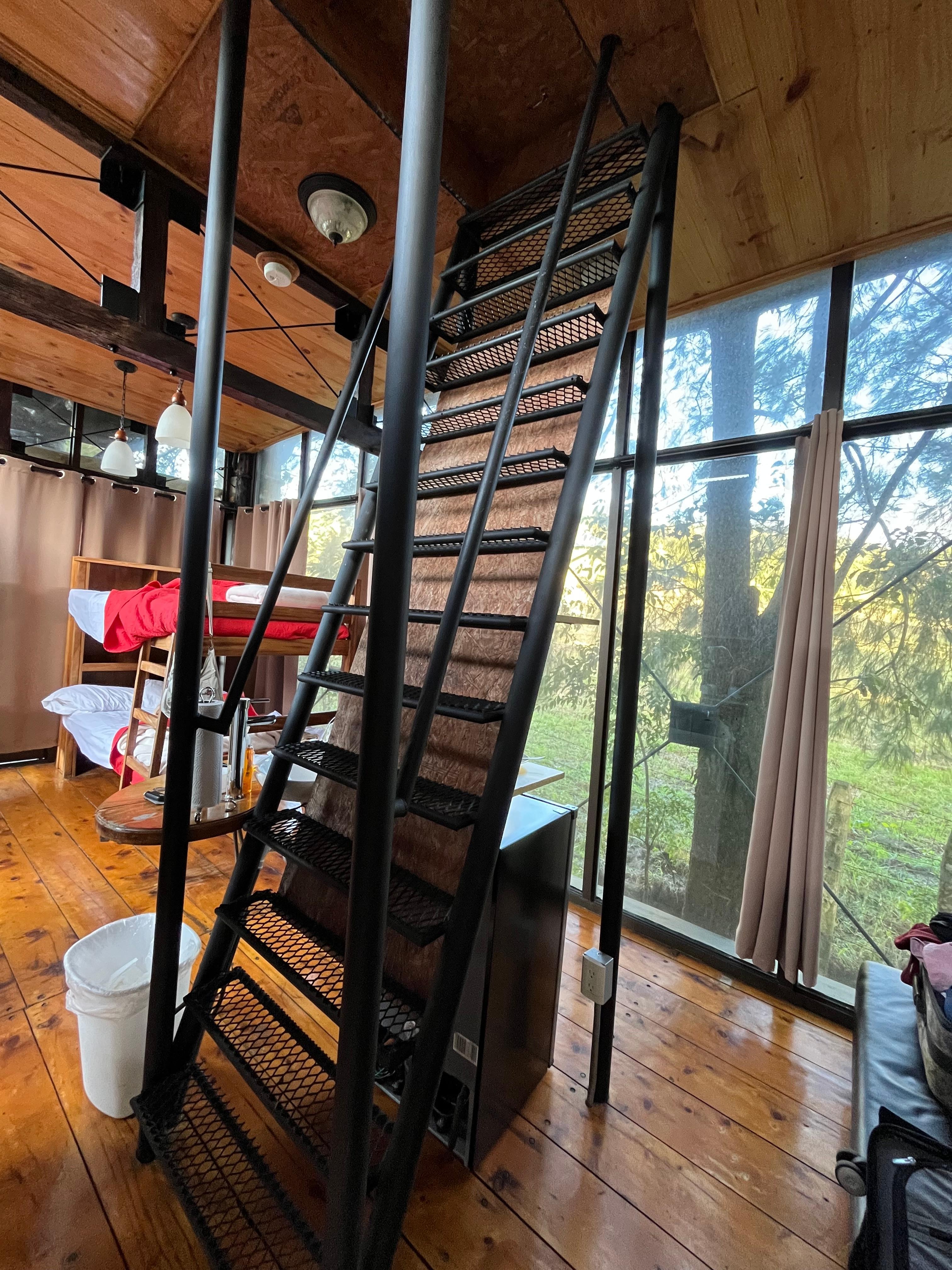 Stairs going to upstairs bed and bathroom