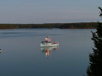 Early photo of lobster boat getting ready to do to work.