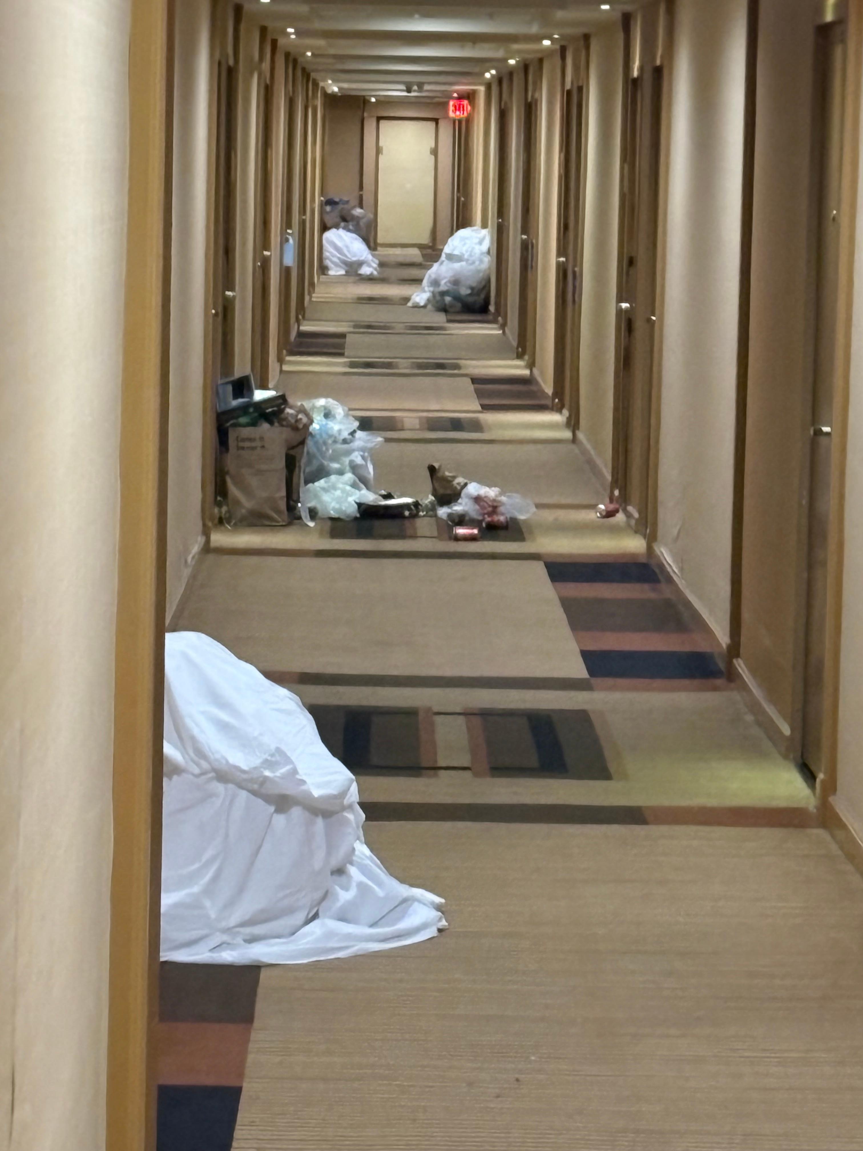 Photo taken in the evening. That is how house keeping left it.  Had to walk through trash to get to and from room