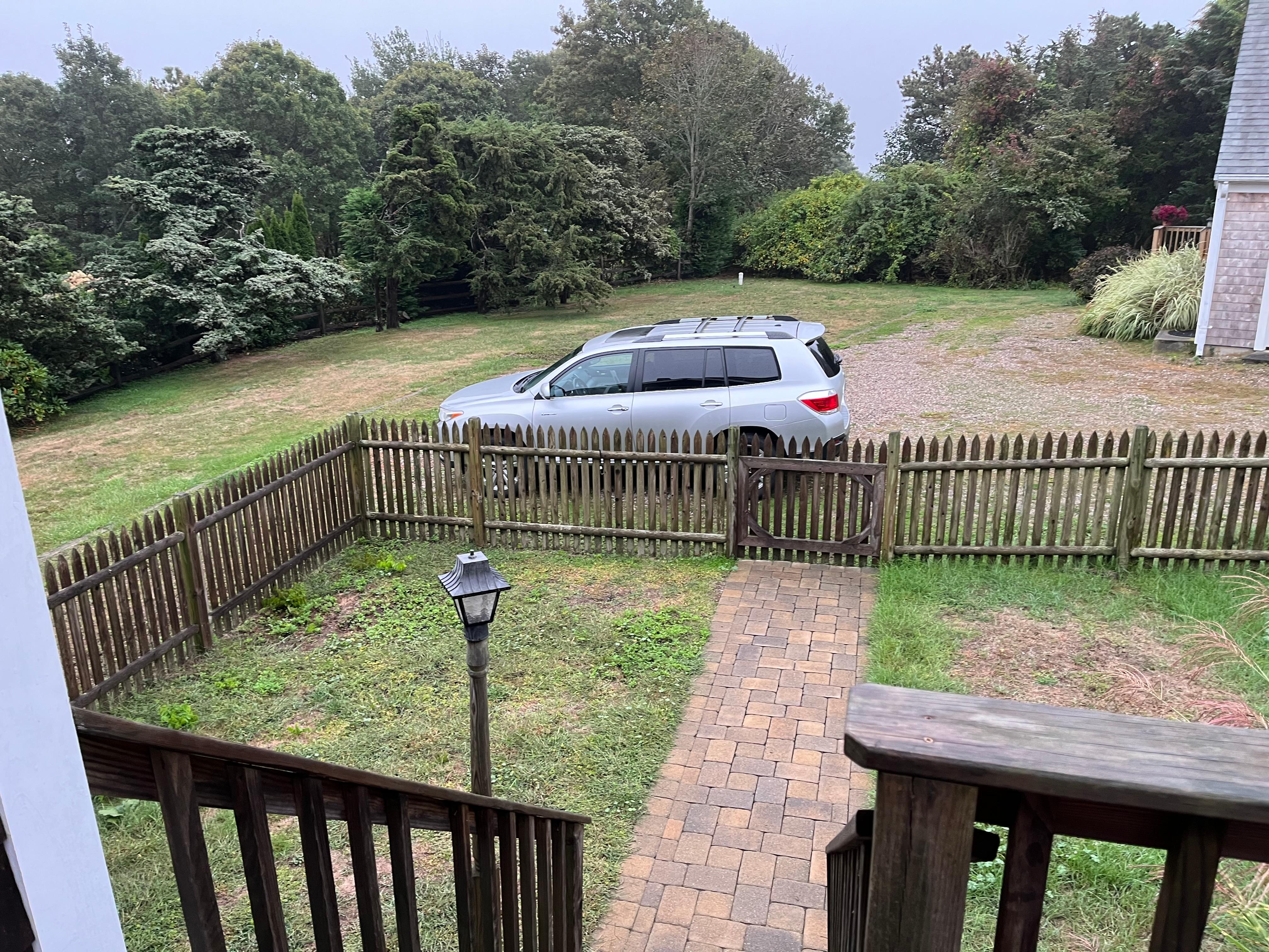 Fenced yard down from deck with outdoor table and chairs. Plenty of parking. Peaceful. 