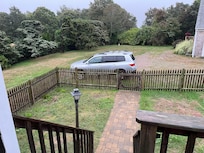 Fenced yard down from deck with outdoor table and chairs. Plenty of parking. Peaceful.