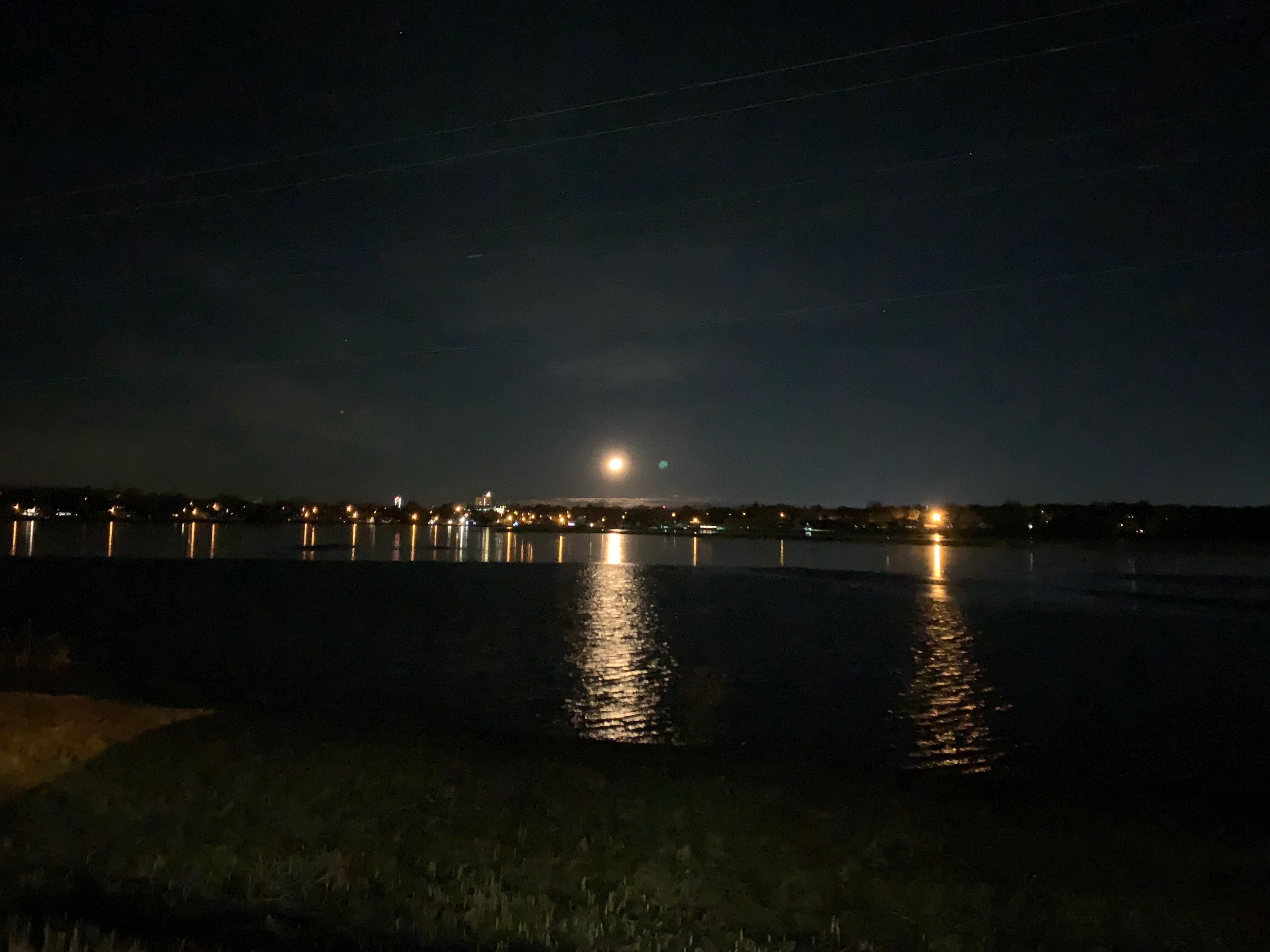 Enjoy the moon setting over ponds.