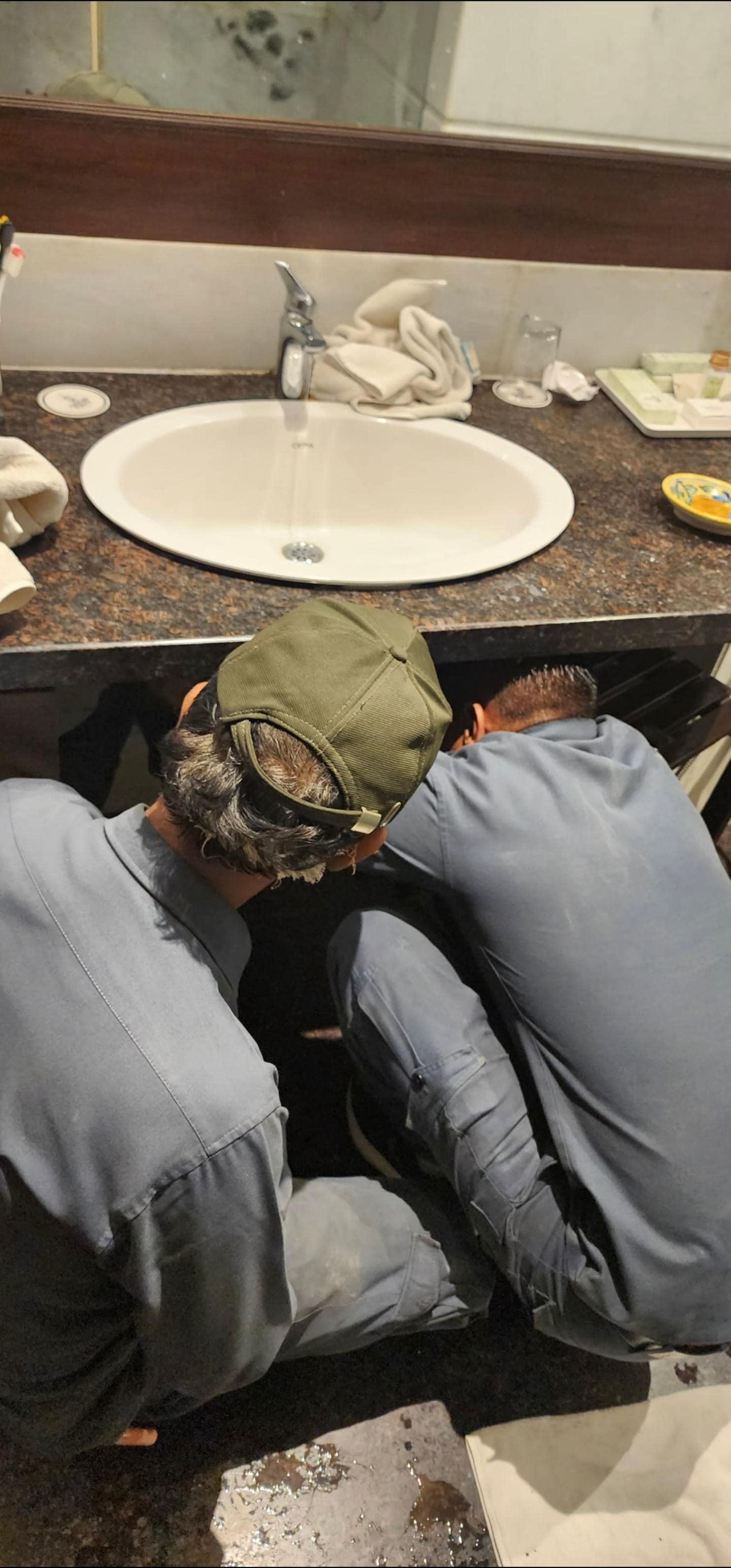 Technician working on fixing water problem 