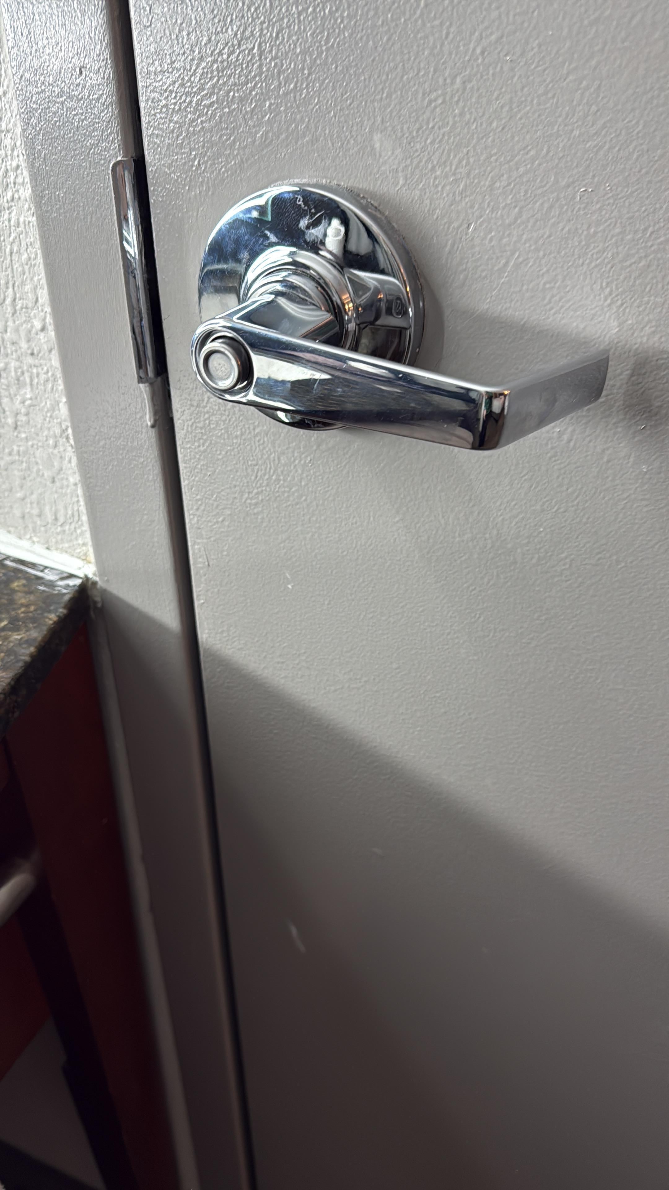Washroom door handle with the lock on the outside 