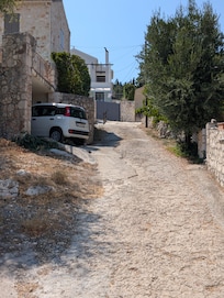 Access road with our Fiat Panda parked. Short and steep