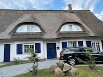 Nearby houses with thatched roof