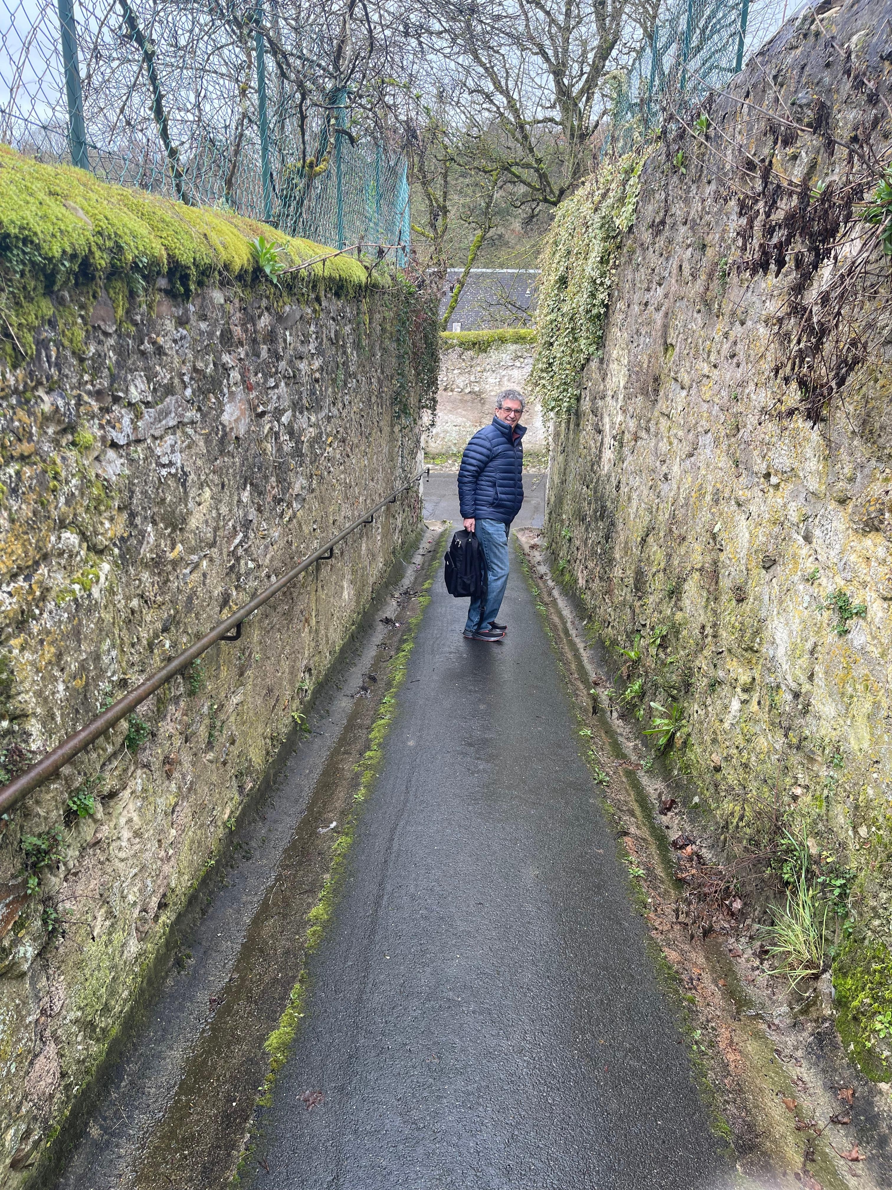 walkway between the road where you park a car and the cave house. 