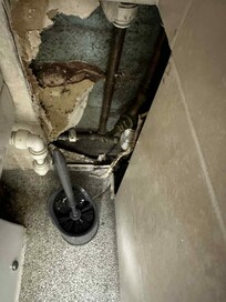 Hole in bathroom wall