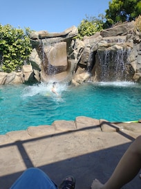 The young folks thoroughly enjoyed the pool with a waterfall slide.slide.