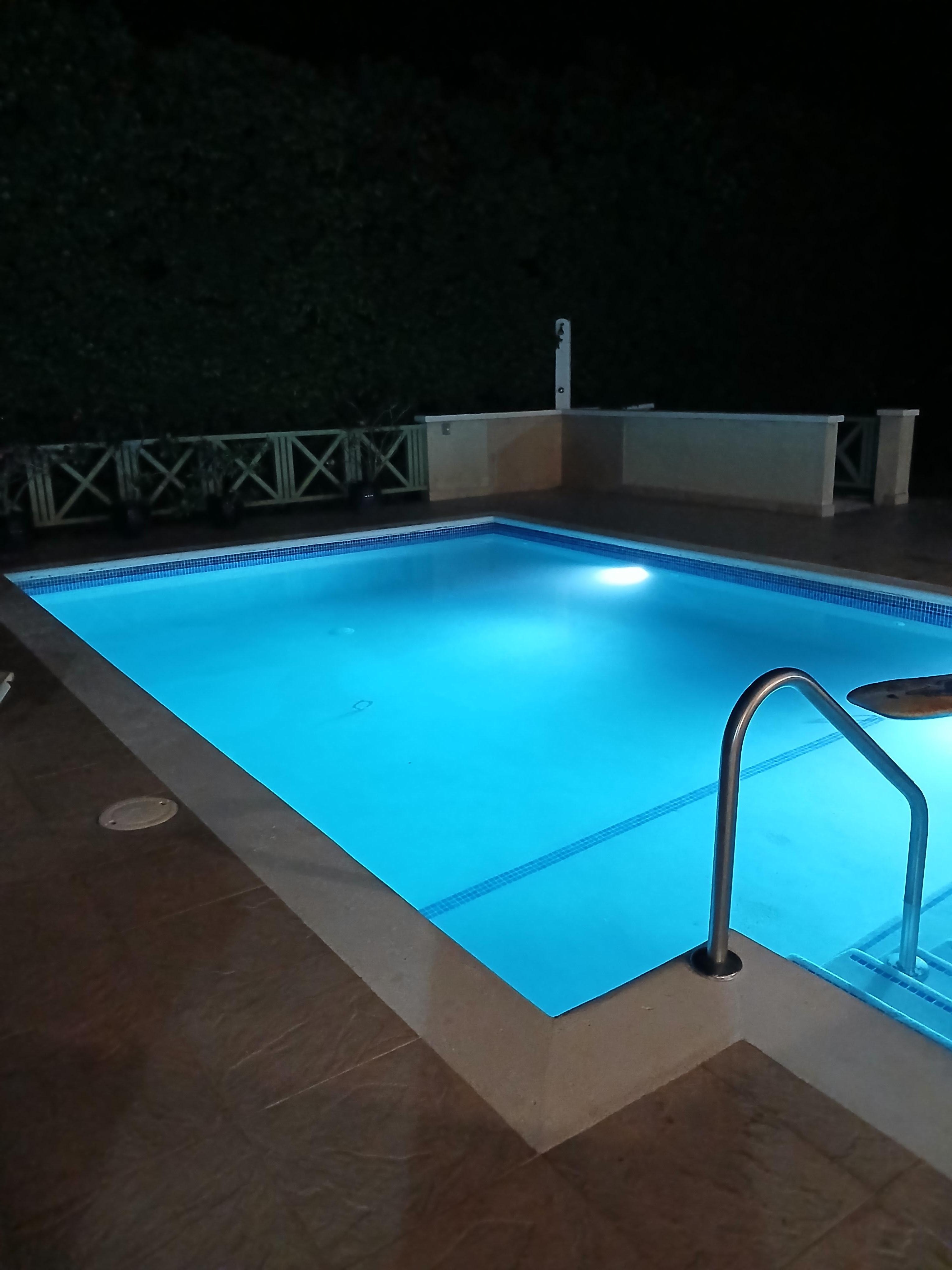 Pool lit up at night