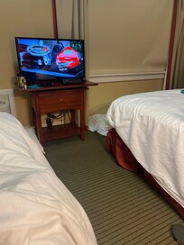 Dirty sheet with hair on it , only 1 person can walk at a time the room is so small