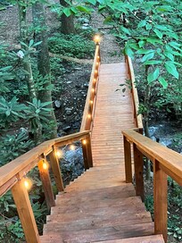 Very pretty lights across the walkway bridge from the deck over to the outside area